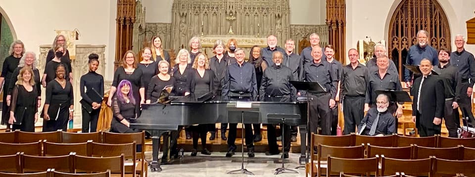 The full CoroAllegro ensemble, thirty-six singers, on the chancel steps.